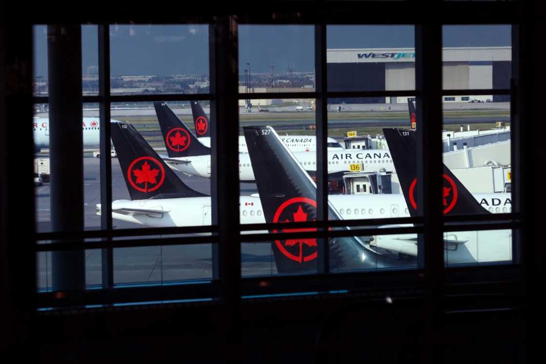 Tails of Air Canada planes are seen at Toronto's airport