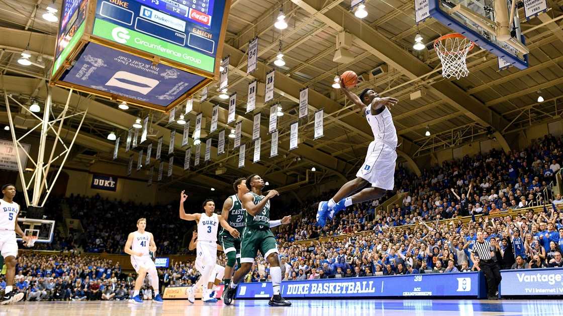 Zion Williamson of the Duke Blue Devils jumps high to dunk (White). Zion Williamson of the Duke Blue Devils jumps high to dunk (White).