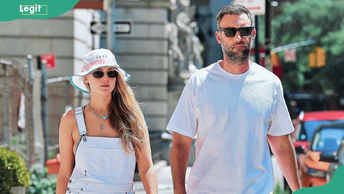 Lawrence and Maroney walking outdoors Lawrence and Maroney walking outdoors