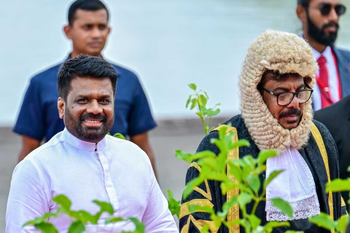 Sri Lanka's President Anura Kumara Dissanayake (L) and Speaker Ashoka Ranwala arrive for the opening of parliament Sri Lanka's President Anura Kumara Dissanayake (L) and Speaker Ashoka Ranwala arrive for the opening of parliament