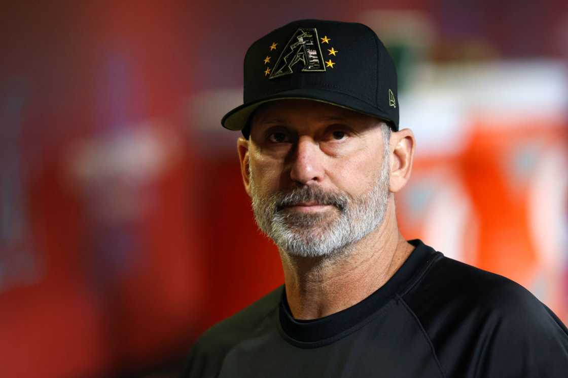 Torey Lovullo looks on from the dugout during the game against the Detroit Tigers Torey Lovullo looks on from the dugout during the game against the Detroit Tigers