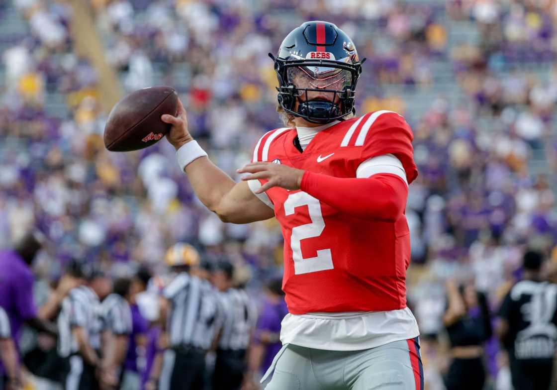 Quarterback Jaxson Dart of the Ole Miss Rebels throws