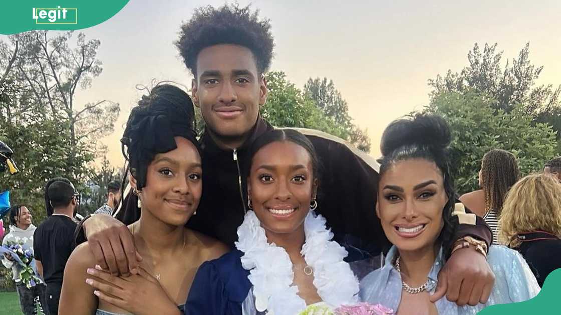 Aloni with her brother Alijah, sister Izena, and their mom on the graduation ground