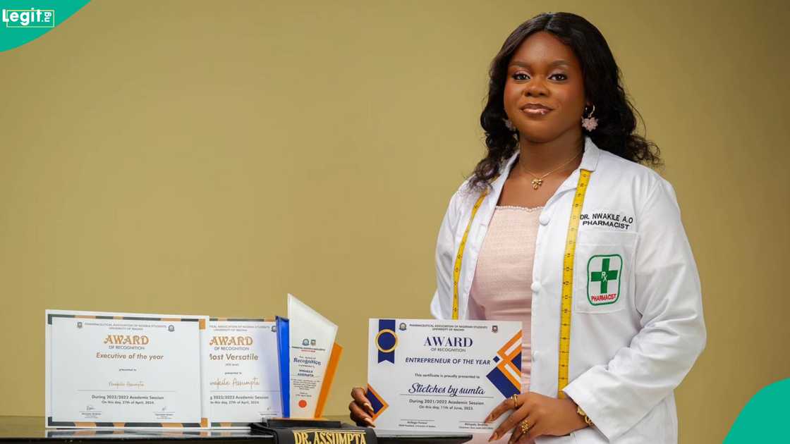 A young Nigerian lady celebrates her induction into the pharmacy profession at the University of Ibadan. A young Nigerian lady celebrates her induction into the pharmacy profession at the University of Ibadan.