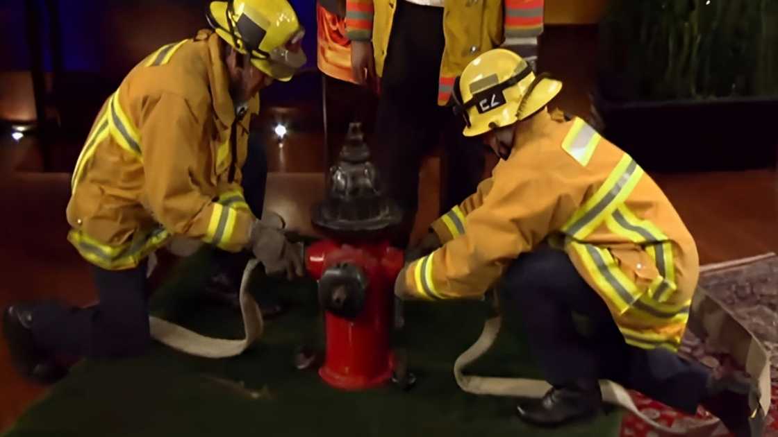 firefighters accompany Jeff Stroope to demonstrate the adapter during the Shark Tank episode.