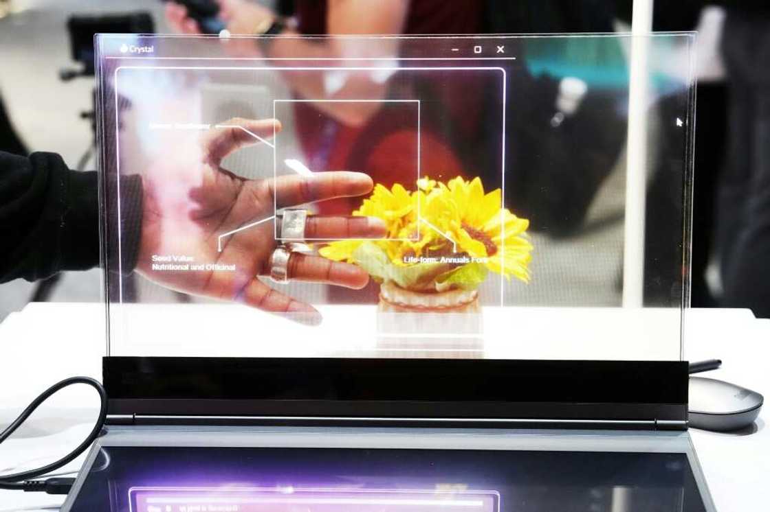 A visitor tests the transparent display of new Lenovo ThinkBook laptop on the first day of the Mobile World Congress (MWC) in Barcelona A visitor tests the transparent display of new Lenovo ThinkBook laptop on the first day of the Mobile World Congress (MWC) in Barcelona