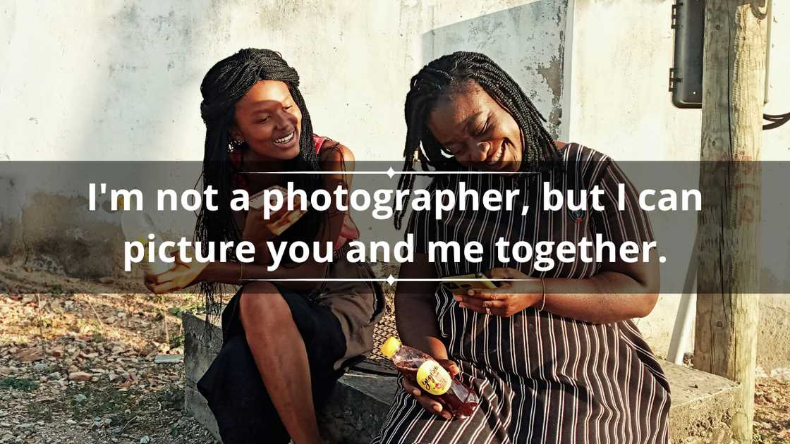 Two women are laughing as they check their phones