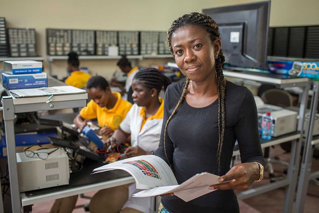 An instructor training students in electrical engineering