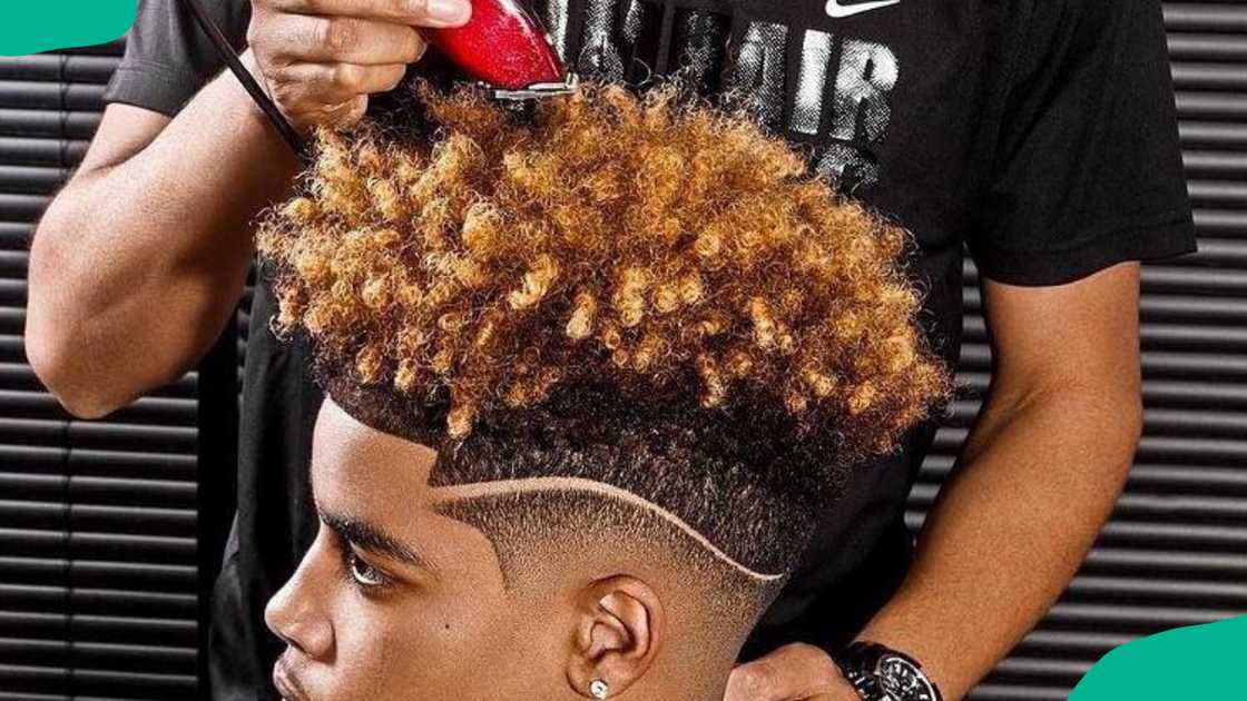 High fade with longer top curls design High fade with longer top curls design