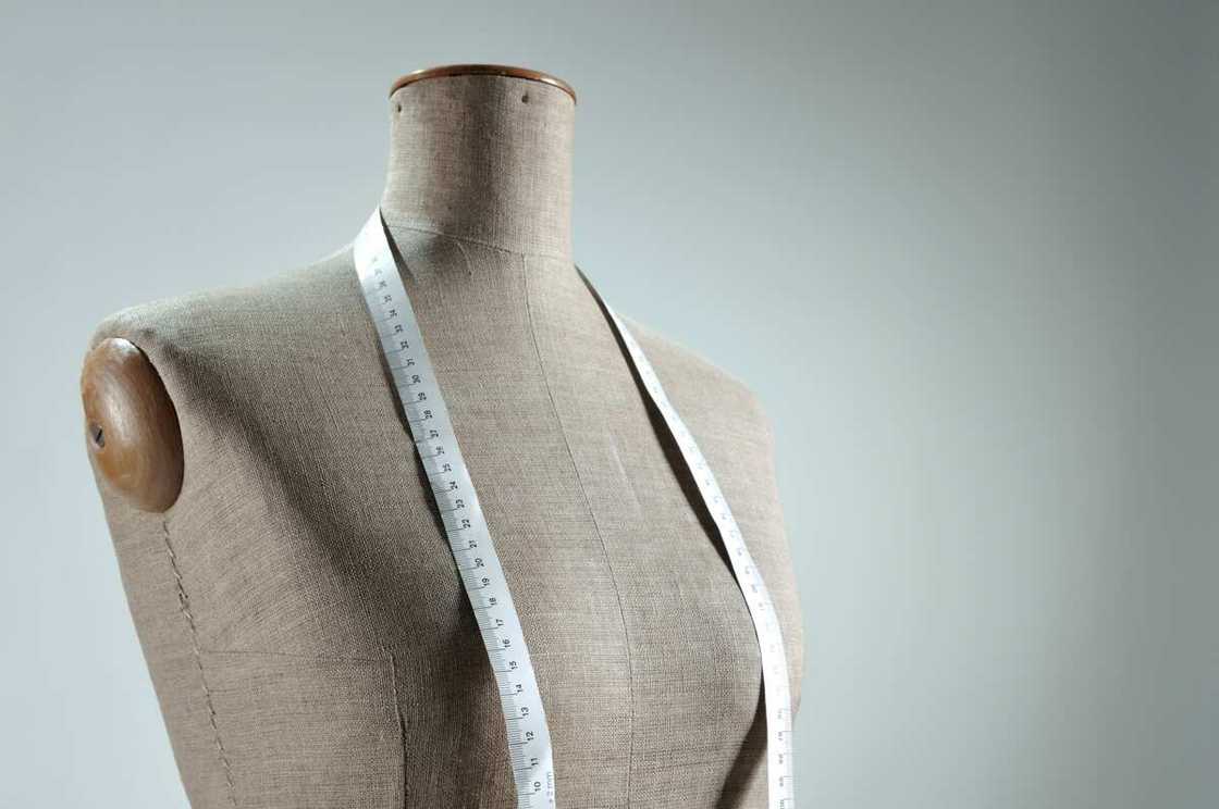 Photo of a dummy with measuring tape. Photo of a dummy with measuring tape.