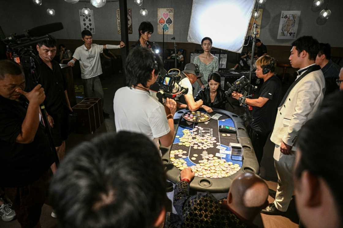 The cast and crew of a Chinese microdrama filming a scene at a microdrama film studio in Shanghai
