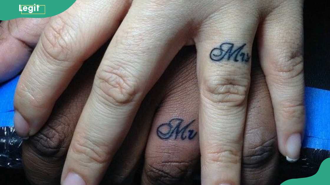 Mr. and Mrs.'s wedding ring tattoo