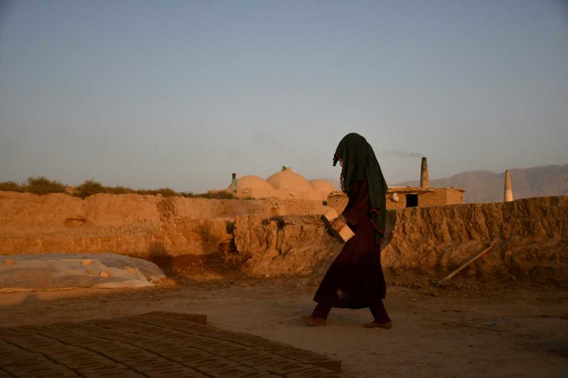 An Afghan woman works at a brick kiln on the outskirts of Mazar-I-Sharif An Afghan woman works at a brick kiln on the outskirts of Mazar-I-Sharif