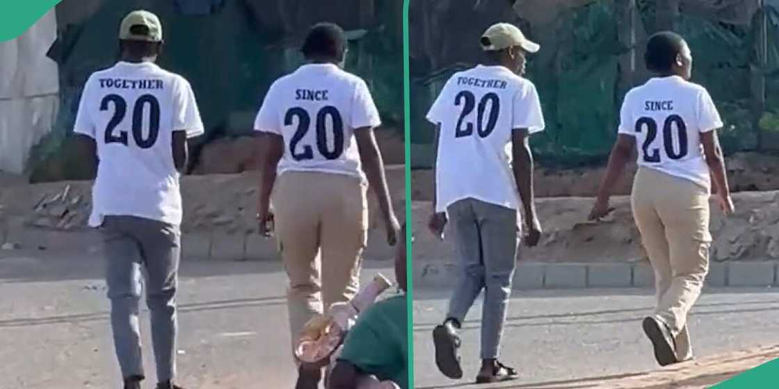 The man and his woman wore matching shirts.