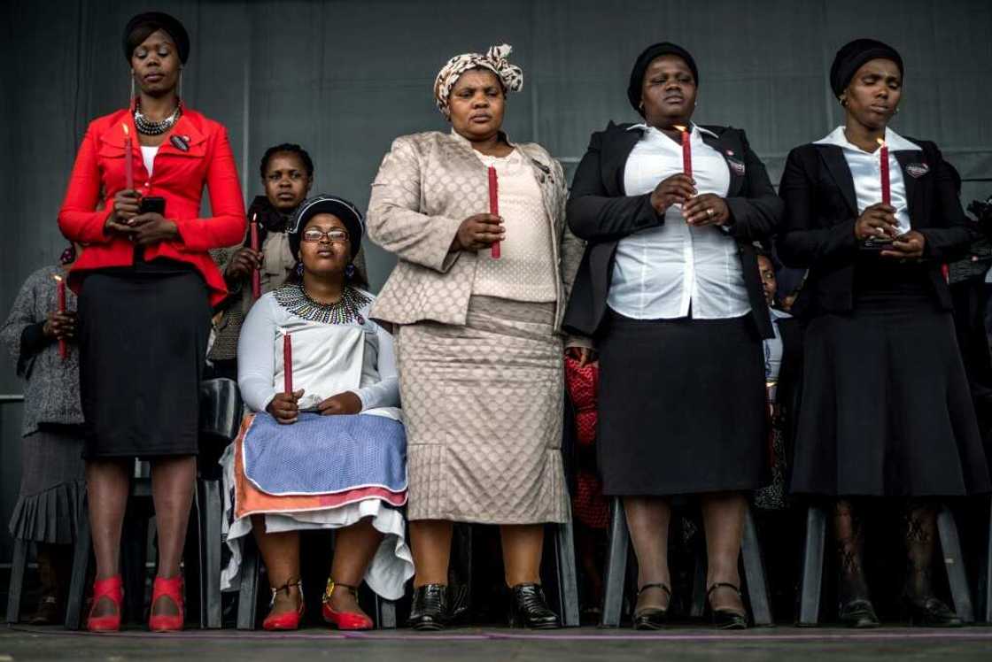 Bereaved family members at a memorial service, two years after the shootings in Marikana Bereaved family members at a memorial service, two years after the shootings in Marikana