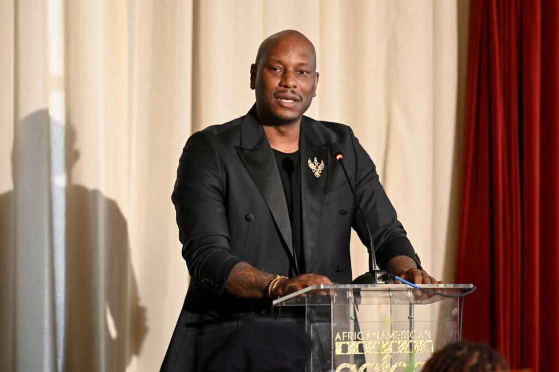 Singer Tyrese giving a speech at an event