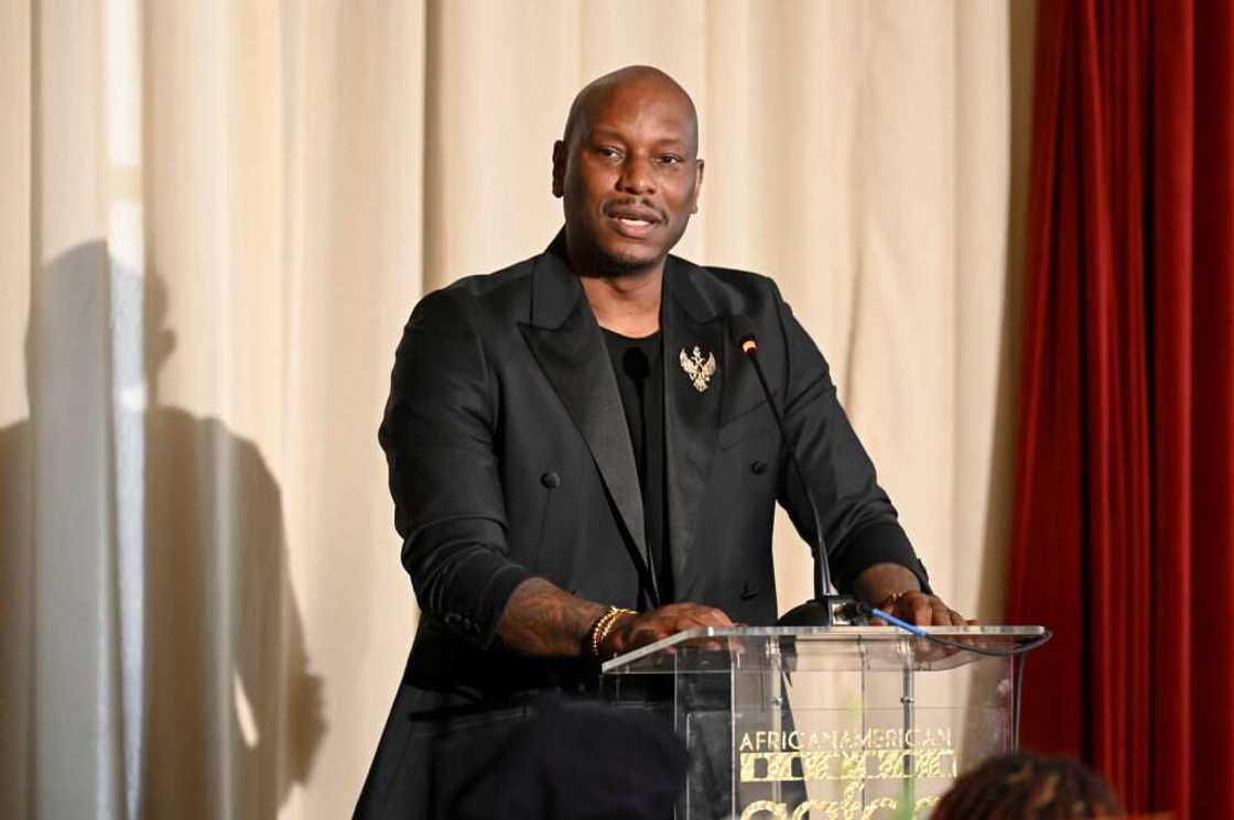 Singer Tyrese giving a speech at an event Singer Tyrese giving a speech at an event