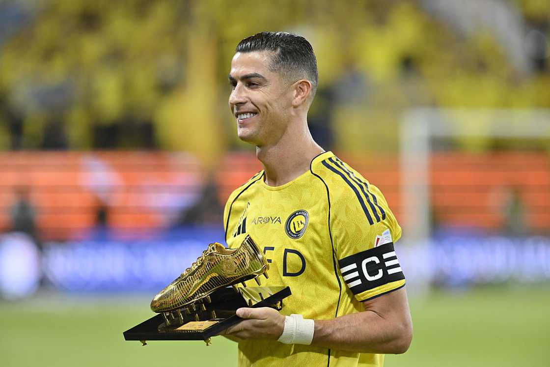 Cristiano Ronaldo of Al Nassr holding the Golden Crampoon award Cristiano Ronaldo of Al Nassr holding the Golden Crampoon award