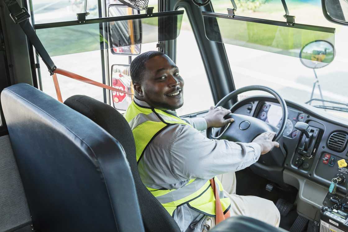 A bus driver smiles A bus driver smiles