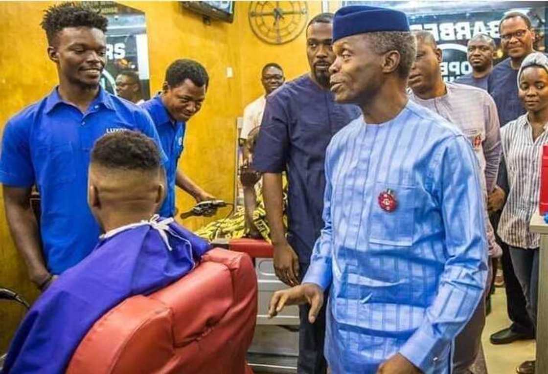 Vice President Yemi Osinbajo spotted cutting his hair in a public barber's shop