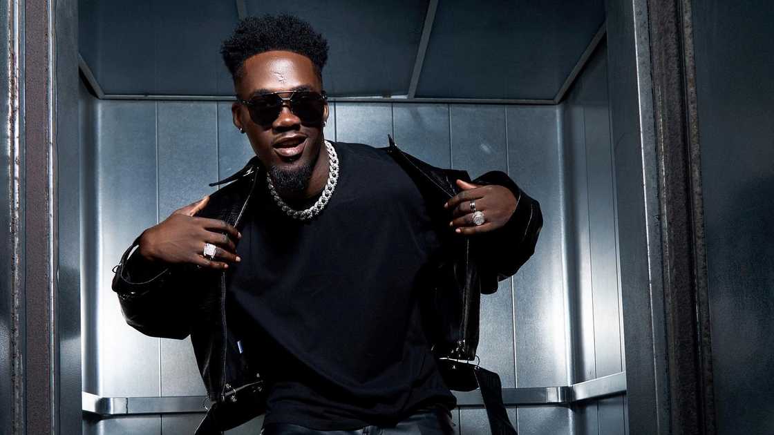 Jason Jae from BBNaija poses in a black outfit and jewellery. Photo: @IamJasonJae