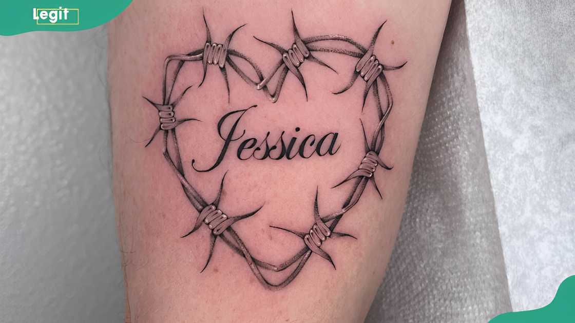 Barbed wire with name tattoo