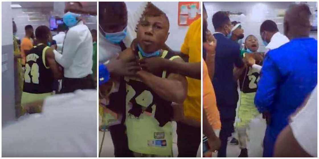Angry Nigerian man threatens to kill self in bank with rope over deductions, bankers tried to stop him in video Angry Nigerian man threatens to kill self in bank with rope over deductions, bankers tried to stop him in video