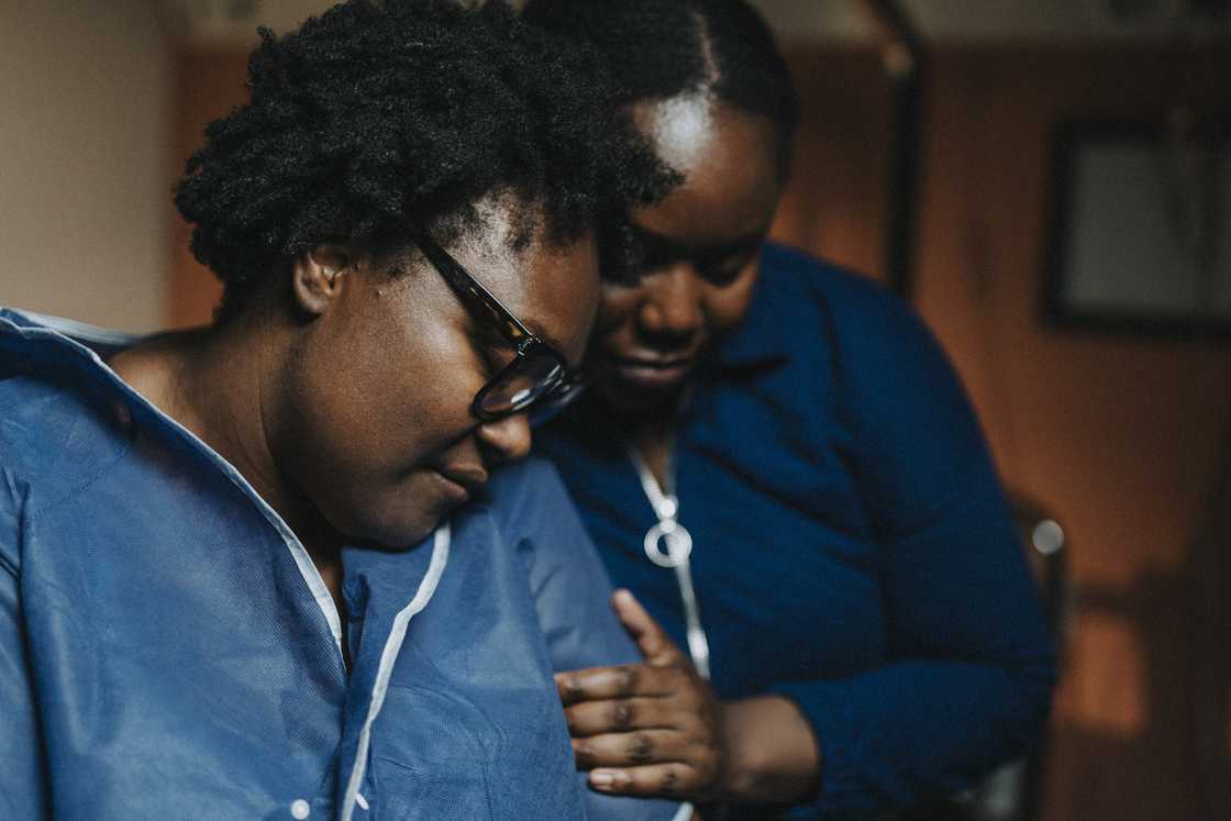 Female friend consoling a worried woman