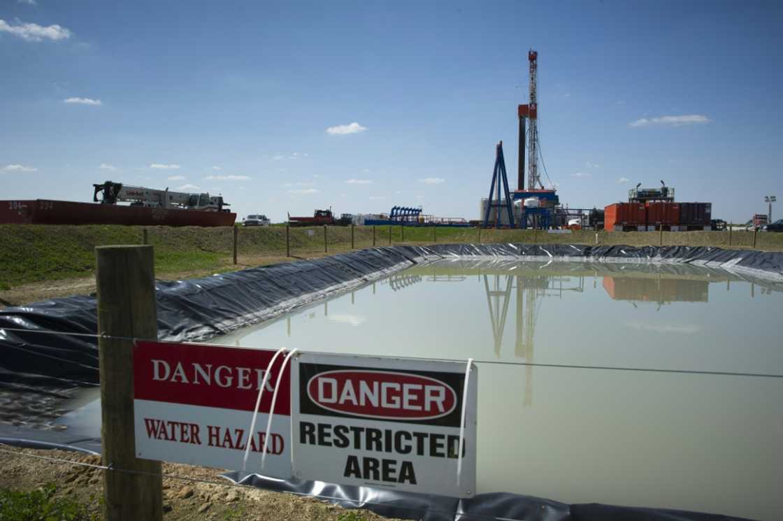 Fracking rigs like this one pictured in the United States inject water and chemicals into rock formations deep underground to release oil and gas