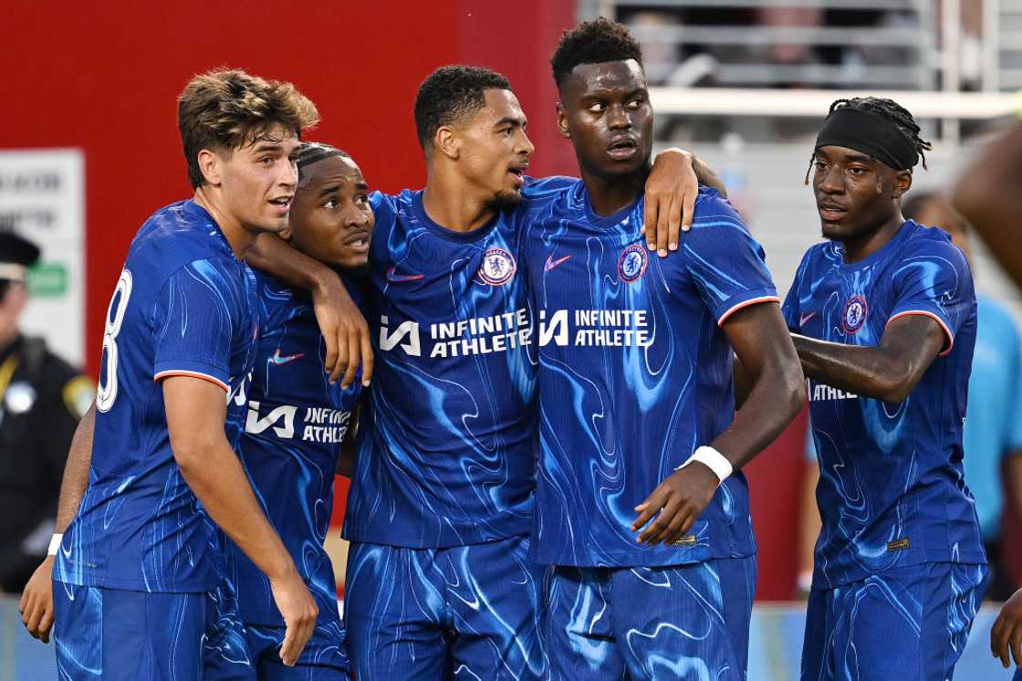 Cristopher Nkunku celebrates with his Chelsea teammates.