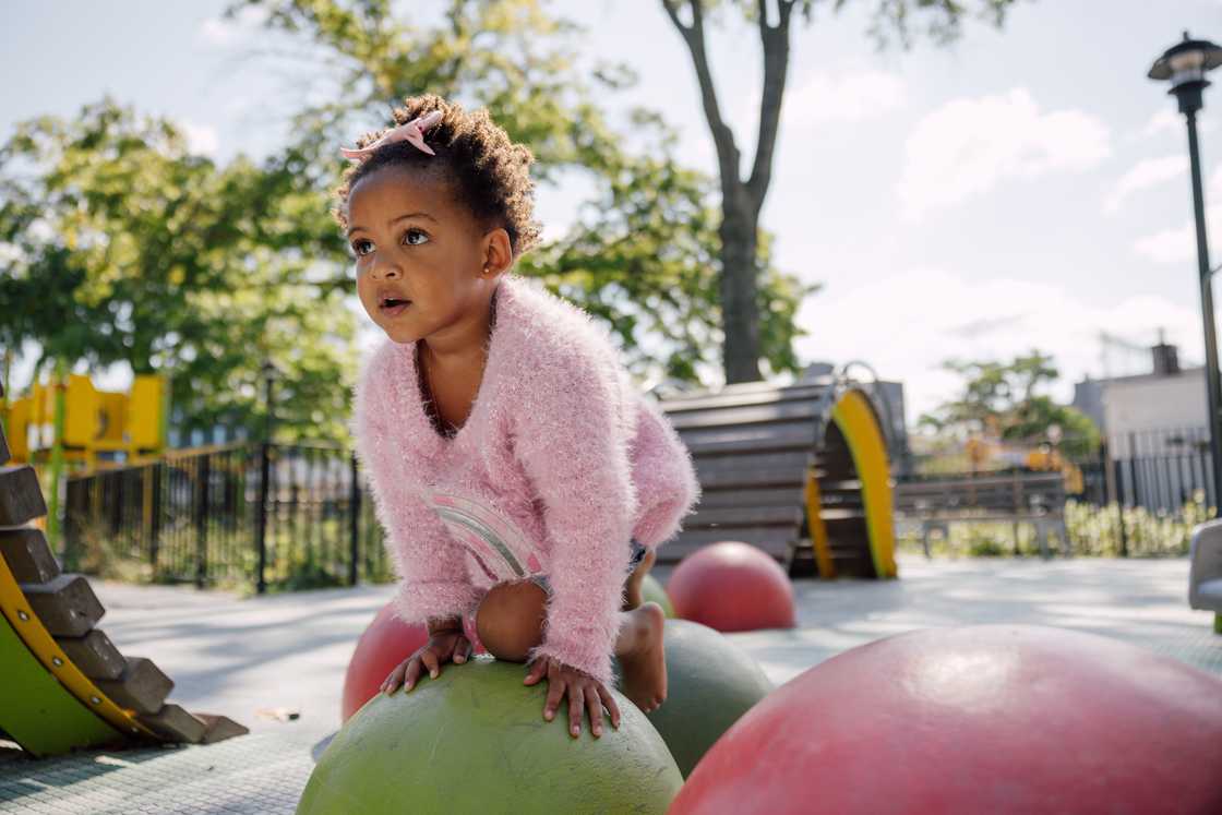A kid palying in the park