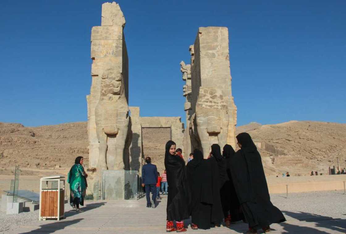 Tourists visit the archaeological site of Persepolis Tourists visit the archaeological site of Persepolis
