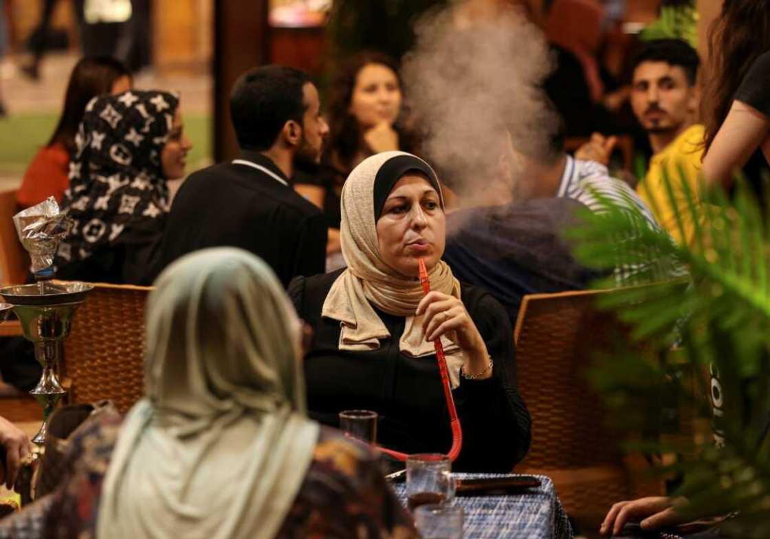 Palestinian women sit at a beach coffee shop in Gaza: but with unemployment rates hitting 47 percent last year, such outings are an unaffordable luxury for many Palestinian women sit at a beach coffee shop in Gaza: but with unemployment rates hitting 47 percent last year, such outings are an unaffordable luxury for many