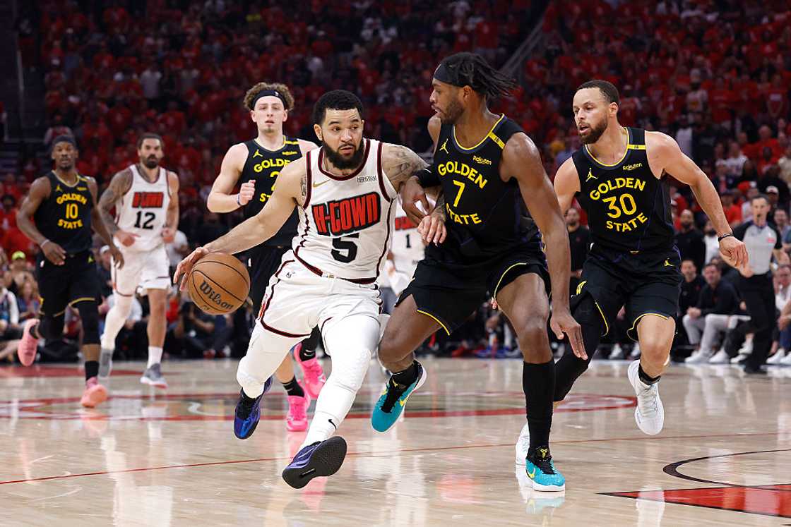 Fred VanVleet of the Houston Rockets dribbles the ball against Buddy Hield of the Golden State Warriors at Toyota Centre in Houston, Texas Fred VanVleet of the Houston Rockets dribbles the ball against Buddy Hield of the Golden State Warriors at Toyota Centre in Houston, Texas