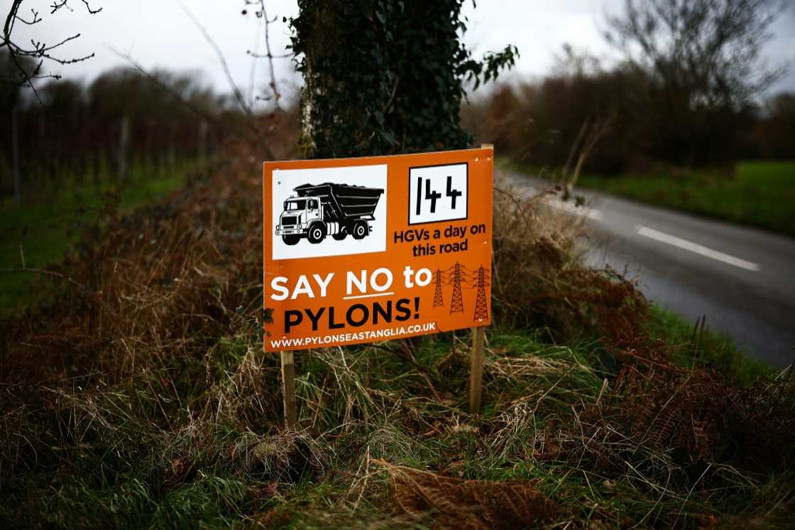 A sign on the side of a UK road protesting against the construction of a new National Grid electricity pylon route