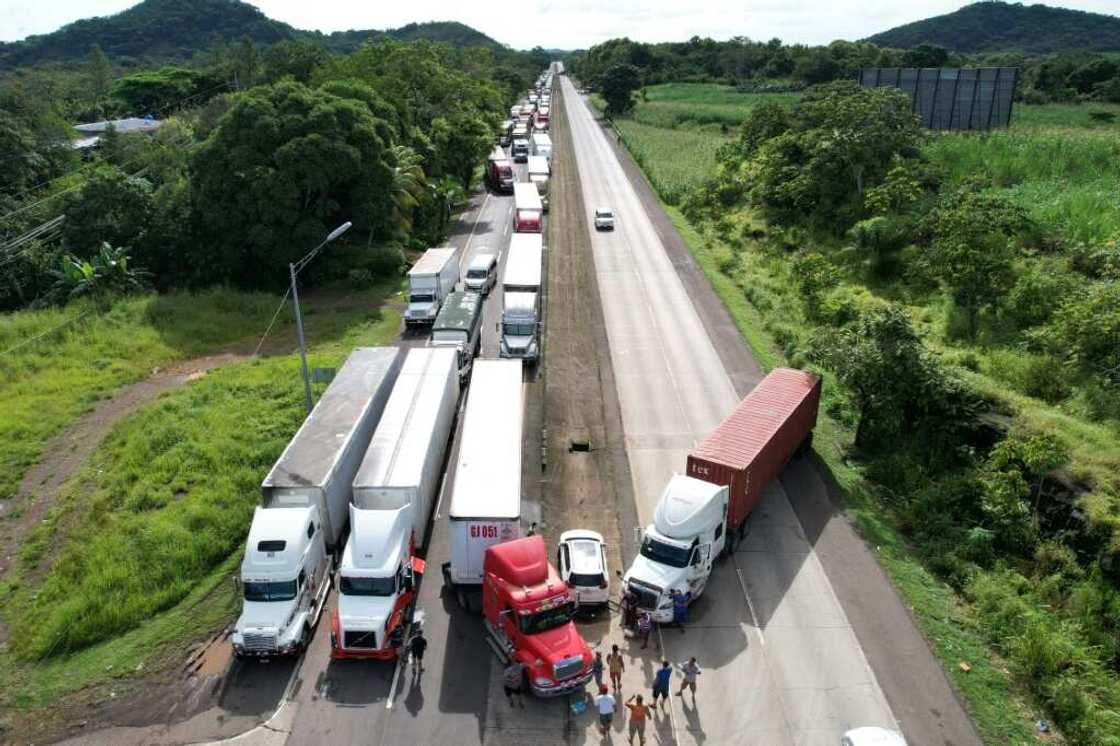 Protesters have blockaded important roads with trucks and burning barricades