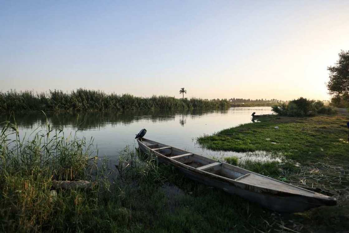 A fishing boat is moored on the banks of a branch of the Euphrates River in the Iraqi town of Al-Hamza A fishing boat is moored on the banks of a branch of the Euphrates River in the Iraqi town of Al-Hamza