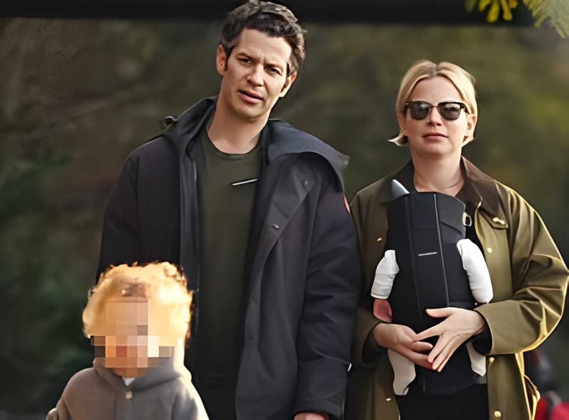 Michelle Williams and Thomas Kail strolling with their children.