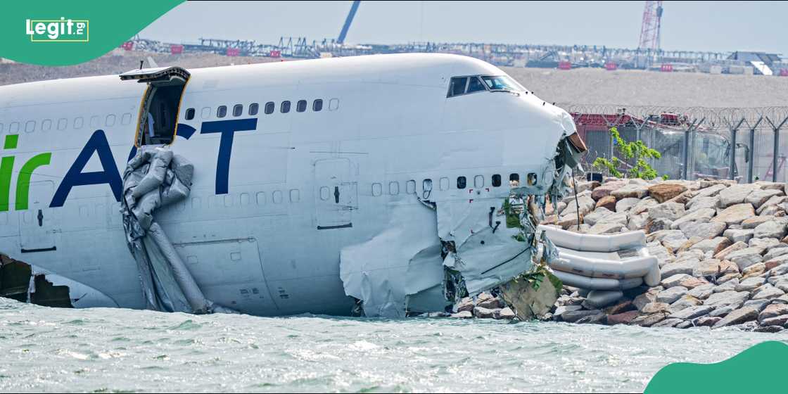 Emergency services surround the damaged Boeing 747 at the Hong Kong International Airport shoreline. Emergency services surround the damaged Boeing 747 at the Hong Kong International Airport shoreline.