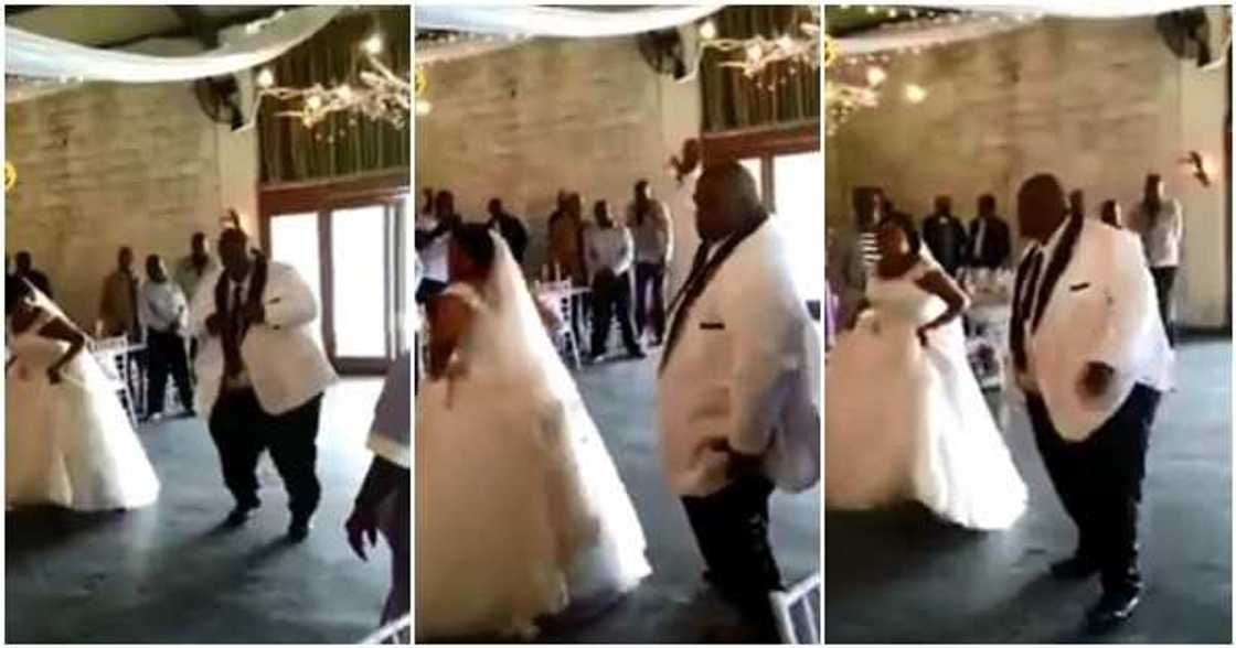 Happy bride and her plus-sized groom rock the dance floor as crowd cheer them on Happy bride and her plus-sized groom rock the dance floor as crowd cheer them on