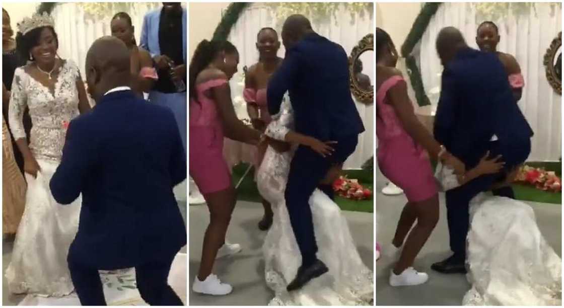 Photos of the moment a groom jumped on his wife during wedding dance. Photos of the moment a groom jumped on his wife during wedding dance.