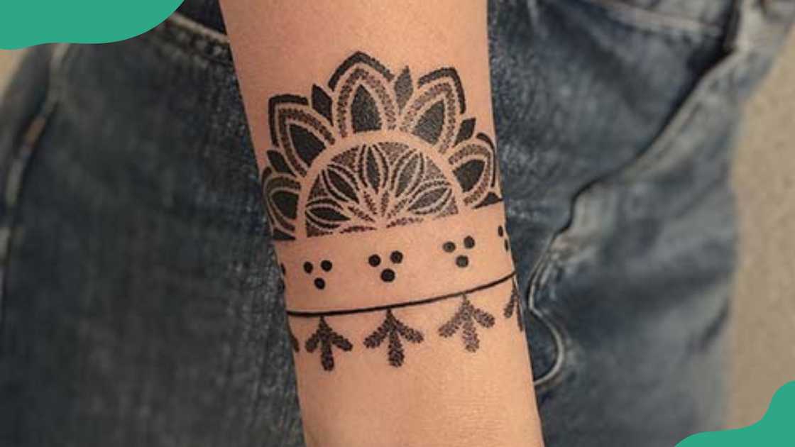 Cute bracelet tattoo with half mandala