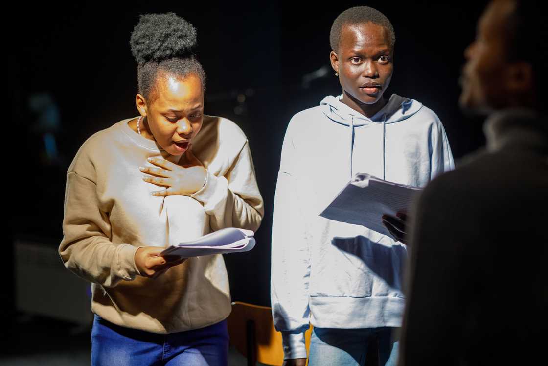 Group of drama student reading a script in acting class Group of drama student reading a script in acting class