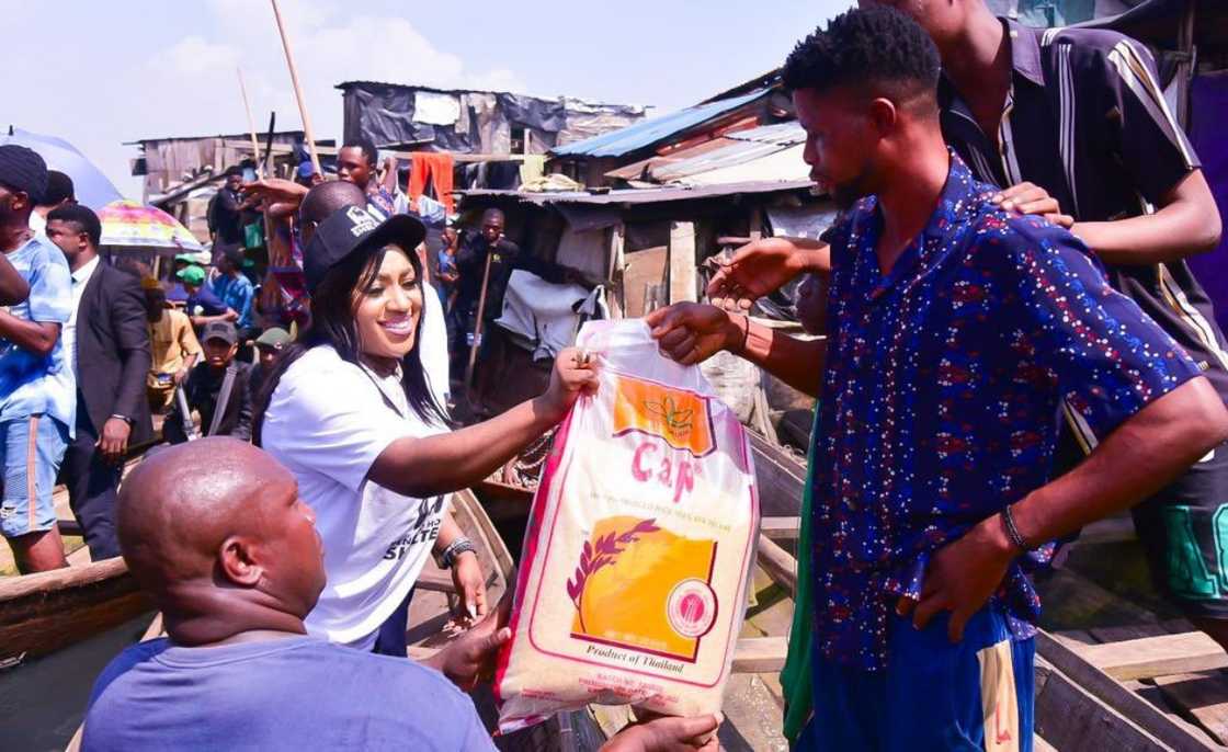 Nigeria's Minister for Humanitarian Affairs and Poverty Alleviation, Dr. Betta Edu gives away food during a social work campaign Nigeria's Minister for Humanitarian Affairs and Poverty Alleviation, Dr. Betta Edu gives away food during a social work campaign