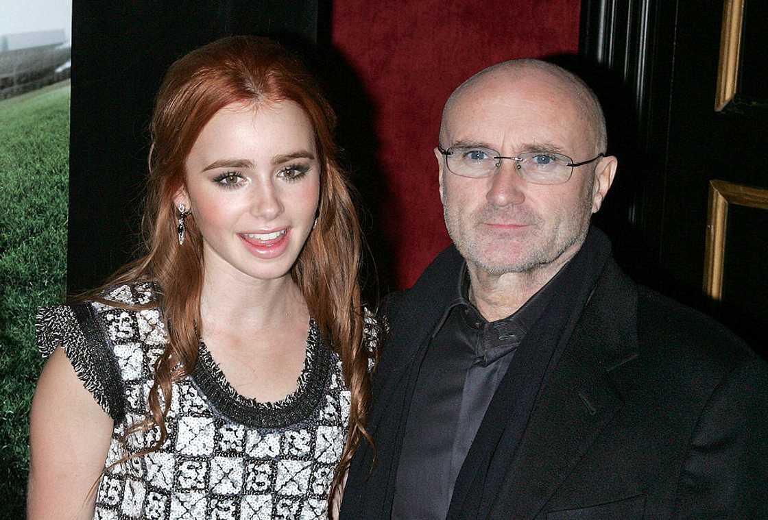 Phil Collins and his daughter Lily Collins attending "The Blind Side" premiere