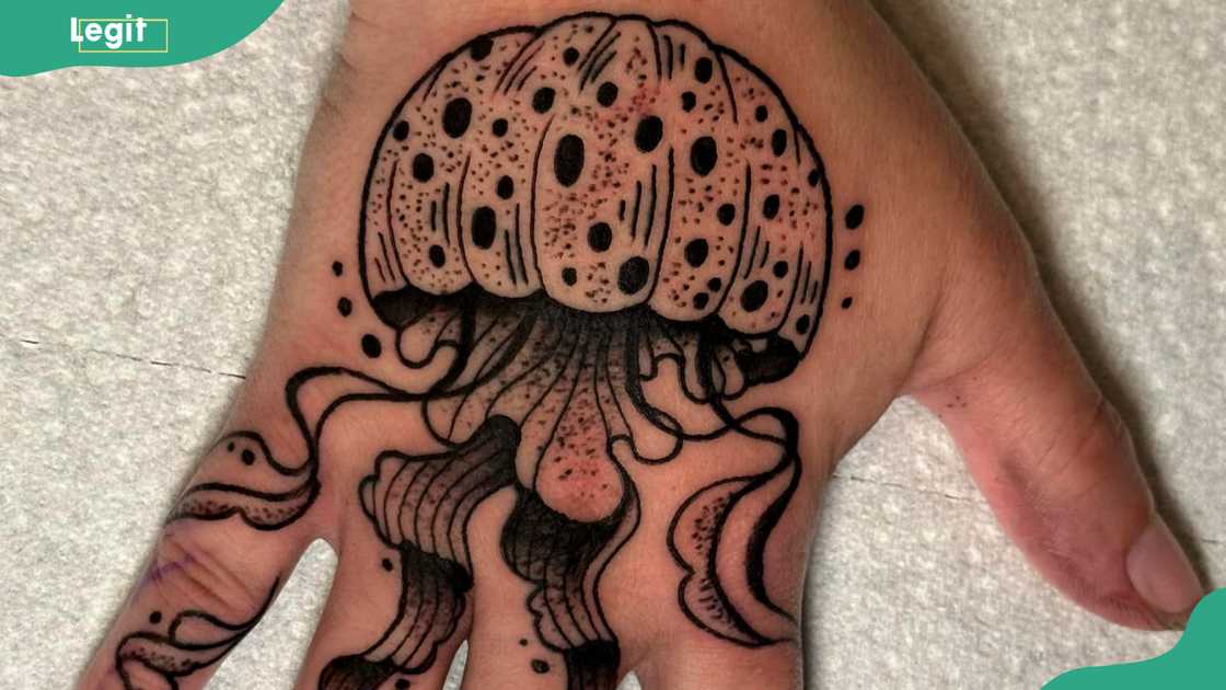 A jellyfish hand tattoo A jellyfish hand tattoo