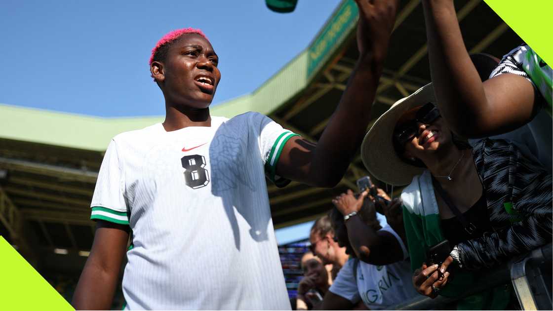 Asisat Oshoala signing autographs for fans during the Paris 2024 Olympics. Asisat Oshoala signing autographs for fans during the Paris 2024 Olympics.