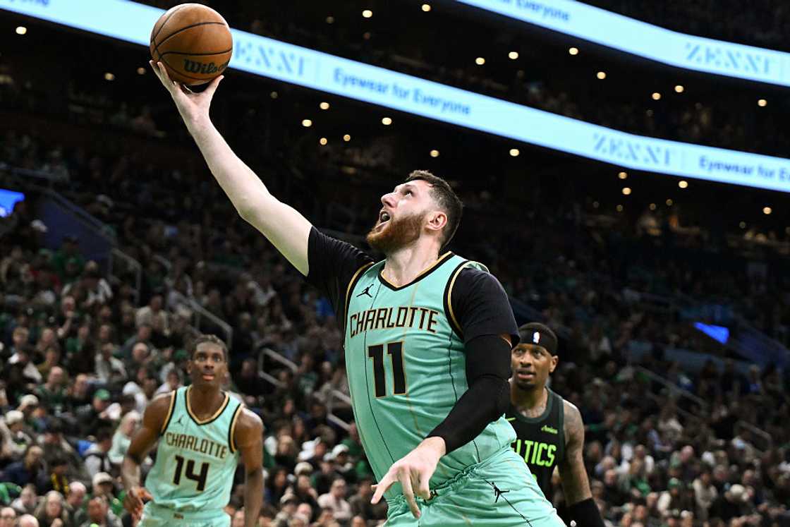 Jusuf Nurkic of the Charlotte Hornets attempts a layup against the Boston Celtics at the TD Garden in Boston, Massachusetts Jusuf Nurkic of the Charlotte Hornets attempts a layup against the Boston Celtics at the TD Garden in Boston, Massachusetts