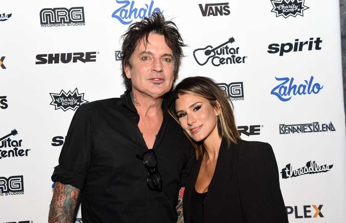 Musician Tommy Lee of Motley Crue (L) and Brittany Furlan (R) attend posing at The Fonda Theatre