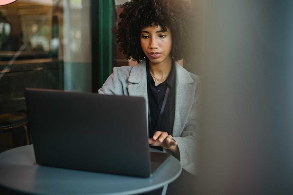 A woman using a laptop at home